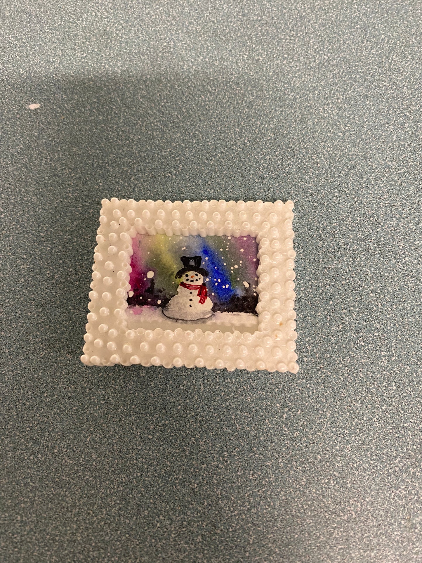 Snowman with Northern Lights in White Frame by Dominique LaVoie