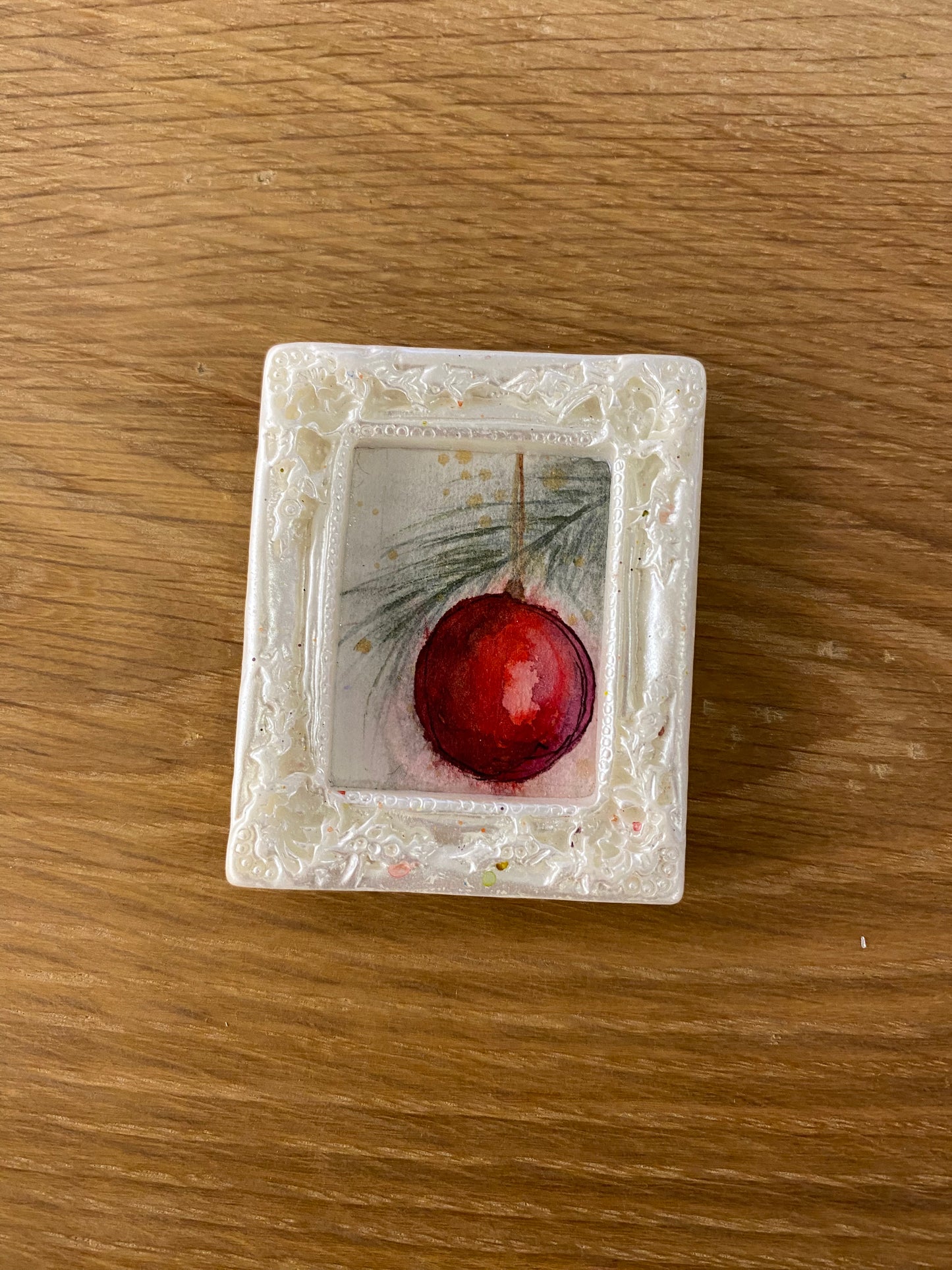 Red Ornament in White Frame by Dominique LaVoie