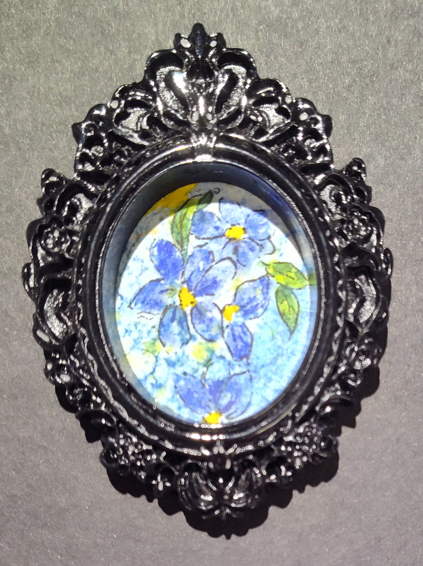 Forget-me-nots in Black Oval frame by Dominique LaVoie