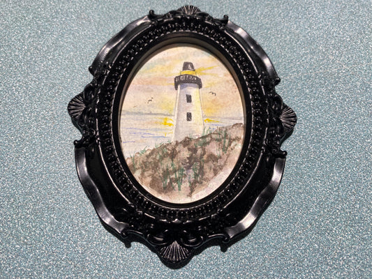 Lighthouse with Black Oval frame by Dominique LaVoie